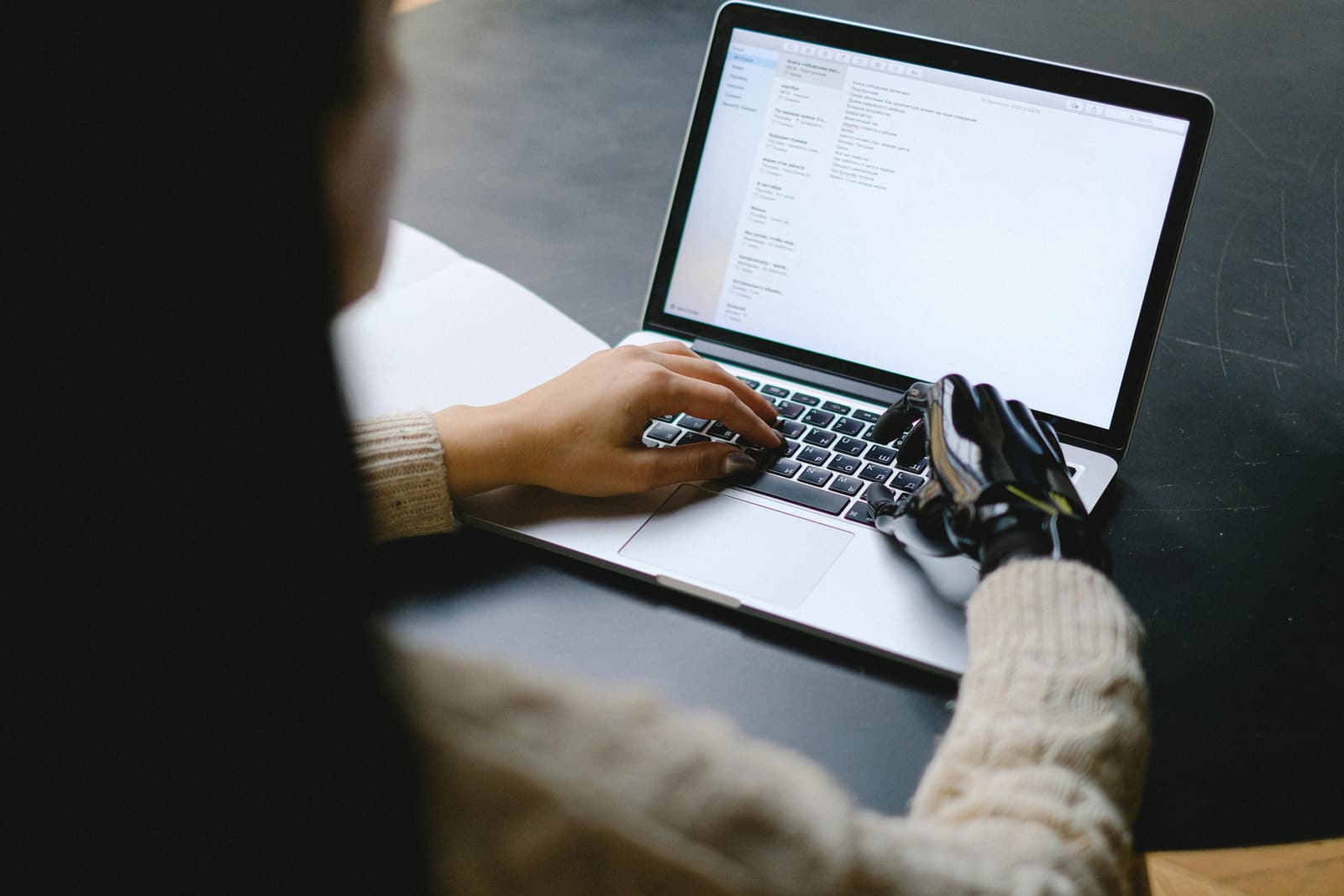 Recruiter reviewing candidate applications on a laptop
